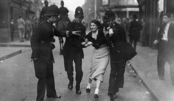 4th October 1936:  Policemen arresting a demonstrator when fascists and communists clashed during a march know as the Battle of Cable Street led by British fascist Sir Oswald Mosley in London's East End.  (Photo by Topical Press Agency/Getty Images)